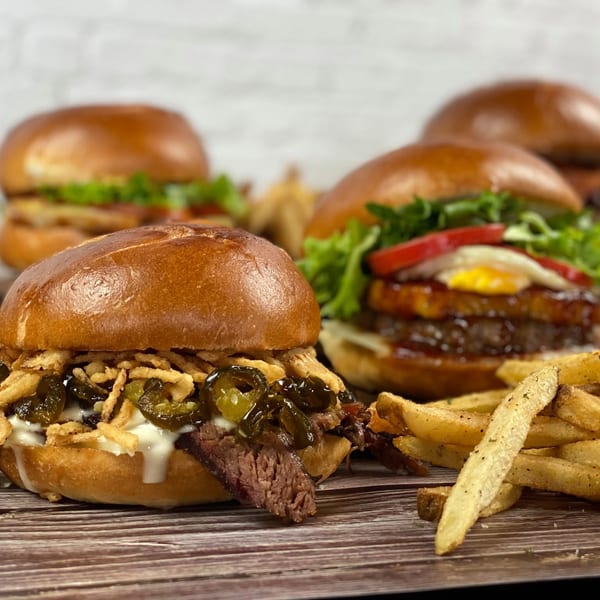 Smoked brisket slider with crispy onions and jalapenos, plus burgers and fries