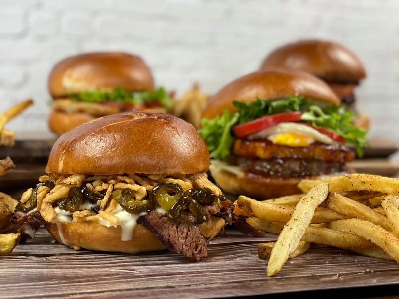 Smoked brisket slider with crispy onions and jalapenos, plus burgers and fries
